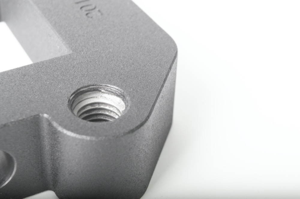 CNC machined steel part with painted finish