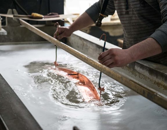 How an electroplated surface finish is applied to metal and plastic parts