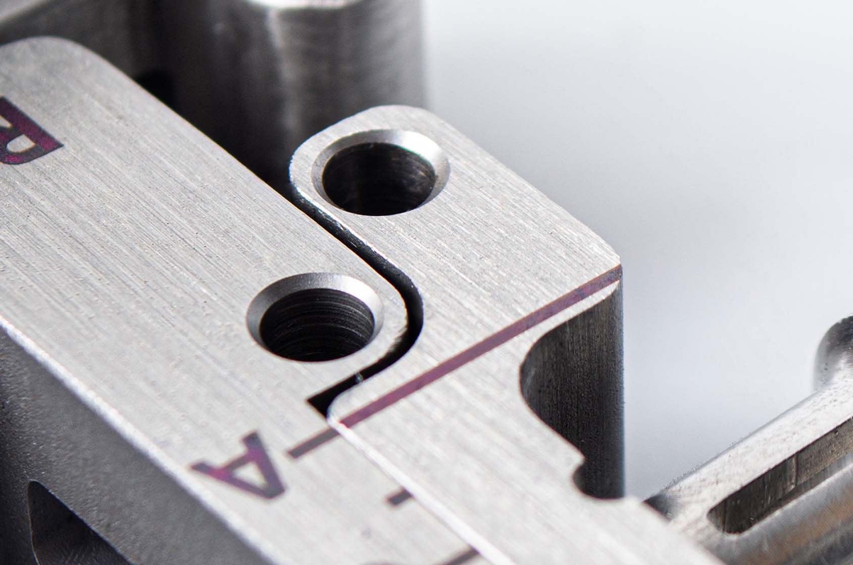 CNC milled part with a brushed finish and laser etched text